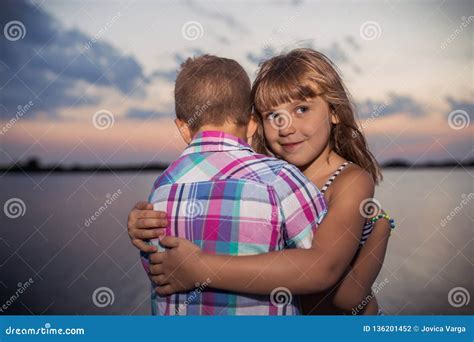 Little Boy and Girl Hugging, by the River Stock Photo - Image of nature ...