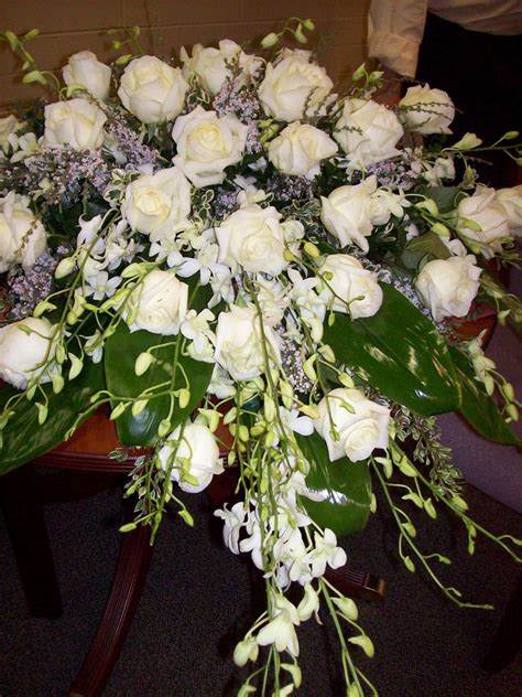 White Roses and Dendrobium orchids casket cover spray | Funeral floral arrangements, Funeral ...