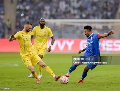 Salem Al-Dawsari of Al-Hilal battles with Marcelo Brozovi of Al-Nassr ...