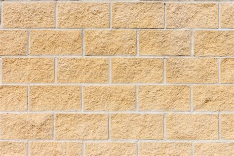 wall texture with yellow sand bricks 20164231 Stock Photo at Vecteezy