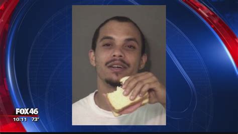 Union County inmate snacks on sandwich in mugshot