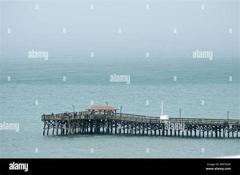 fishing pier at beach Stock Photo - Alamy