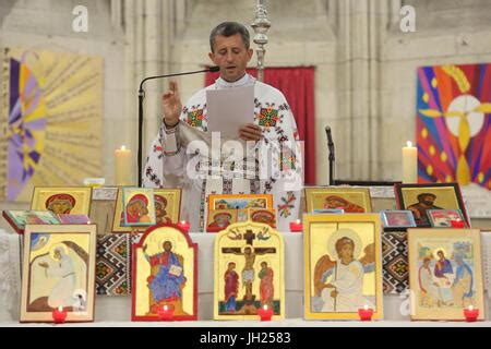 Melkite (Greek-catholic) priest blessing icons in Sainte Foy church ...