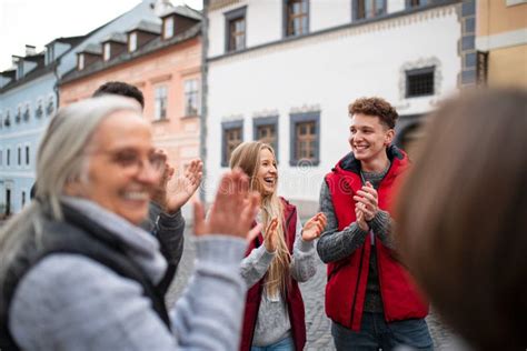 Diverse Group of Happy Community Service Volunteers Claping Hands Outdoors in Street Stock Photo ...