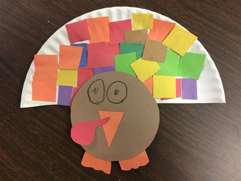 Made these turkeys out of half of a paper plate for our kindergarten Thanksgiving unit ...