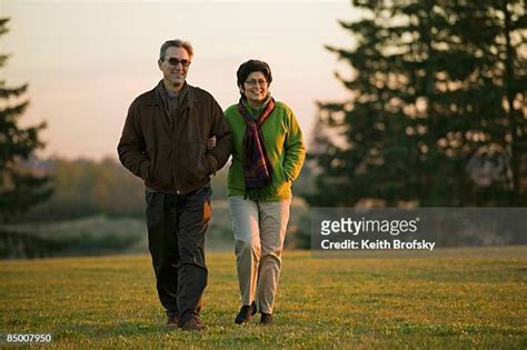 Couple Linking Arms Photos and Premium High Res Pictures - Getty Images