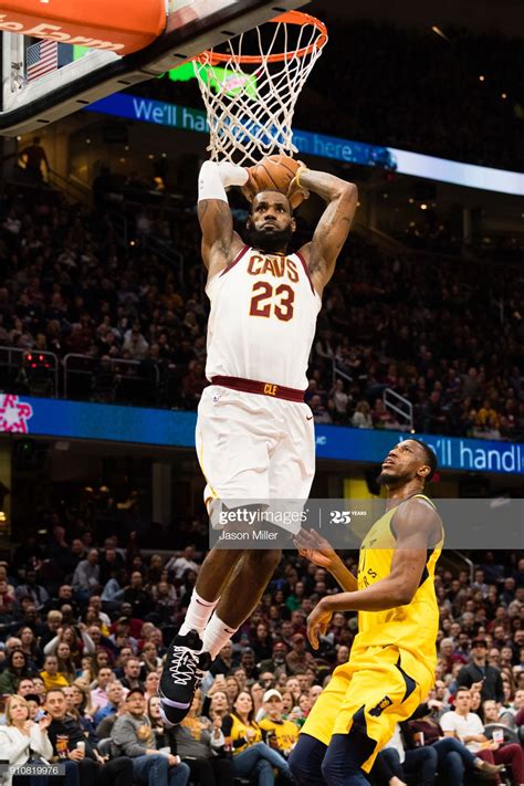 LeBron James of the Cleveland Cavaliers dunks over Thaddeus Young of ...