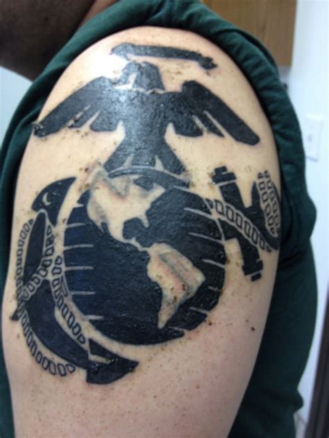 Black usmc military tattoo on shoulder - Tattooimages.biz