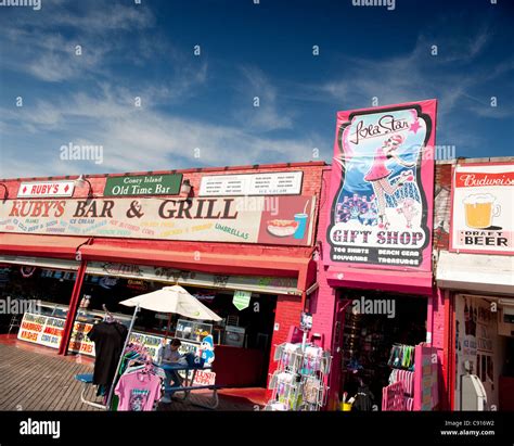 Coney Island is famous for its amusements boardwalk seaside cafes and fairground attractions and ...