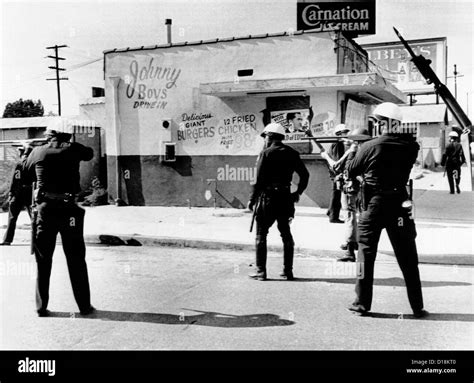 1965 Watts Riot. Police and National Guardsmen hold guns ready as the ...