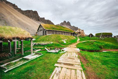 Traditional Viking village. Wooden houses near the mountain first settlements in Iceland ...