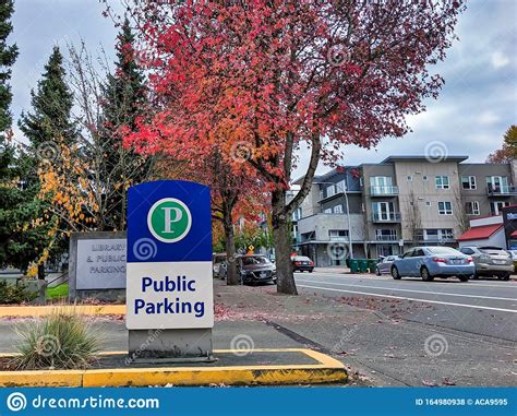 Street View of the King County Public Library and Public Parking Signs in Downtown Editorial ...