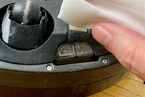 How to clean a Roomba's charging contacts and cliff sensors | TechHive