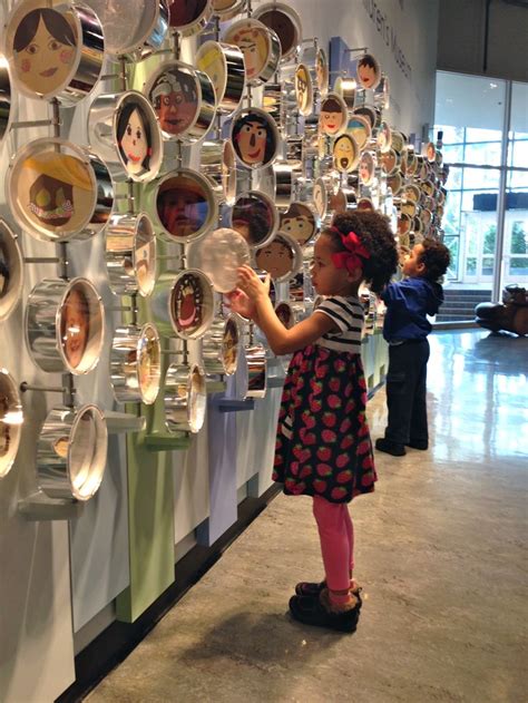 My kids at the Chicago Children's museum. I like how these spin and the shiny material on the ...