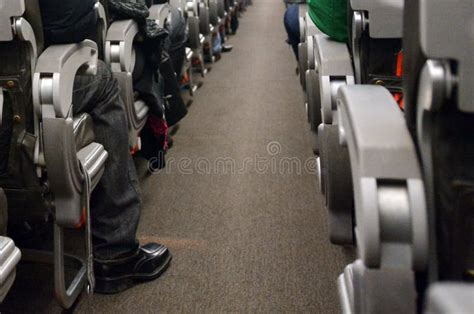 Airplane aisle and seats stock image. Image of passengers - 43921207