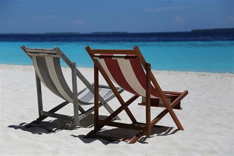 Two Folding Chairs on White Sand Seashore · Free Stock Photo