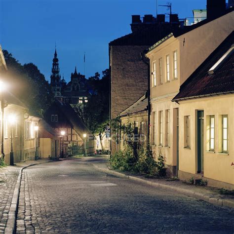 Street of old town illuminated at night — tower, Information Sign ...