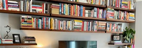 Massive Wall of Floating Bookshelves - How To Install - South House Designs