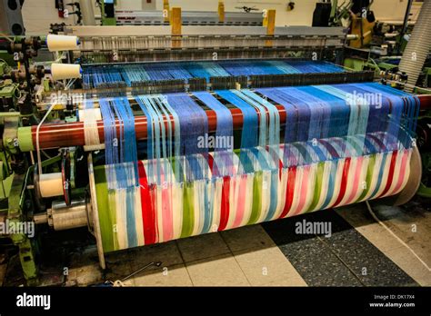 Modern weaving machine producing elaberate patterned textile for the Stock Photo: 63337740 - Alamy