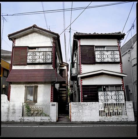 Suburbs--"Old" houses going to seed. In Japan houses built in the 1960's or 1970's are already ...