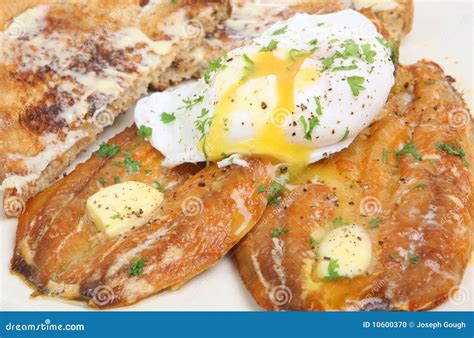 Kippers and Poached Egg Breakfast Stock Photo - Image of melting, pepper: 10600370