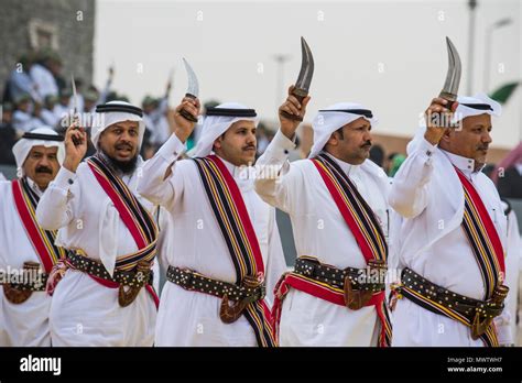 Traditional dressed local tribesmen dancing at the Al Janadriyah ...