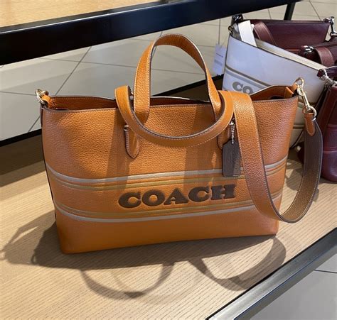 Coach Logan Carryall, Luxury, Bags & Wallets on Carousell