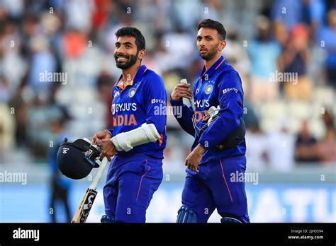 Jasprit Bumrah of India is all smiles as he leaves the field at the end ...