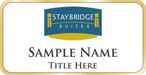 Staybridge Suites Shaped White badge With Gold SB Frame - $9.34 | NiceBadge™