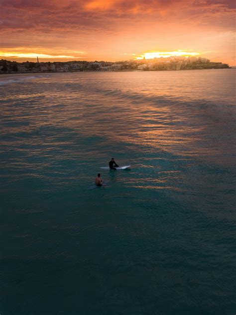 Photo of Two People Surfing in Bondi Beach · Free Stock Photo