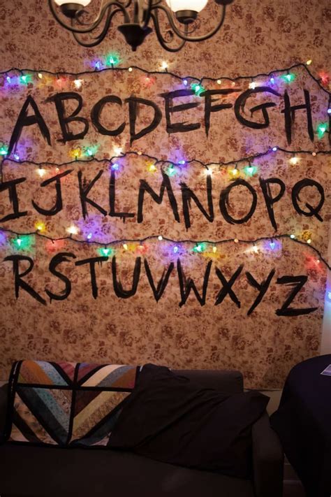 a wall with lights and letters written on it