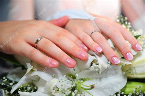 Bride and groom and wedding rings — Stock Photo © evdoha #4455818