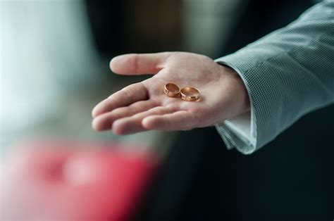 Premium Photo | Wedding rings on hands