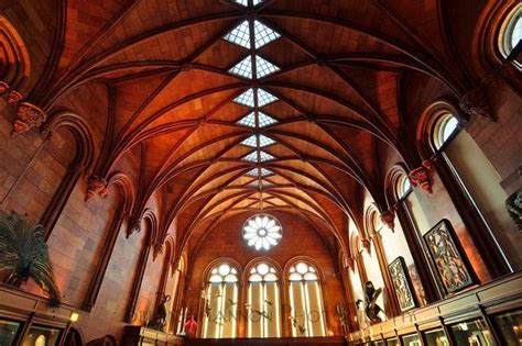 the inside of a large cathedral with high ceilings and stained glass ...