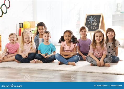 Group of Cute Little Children Sitting on Floor. Kindergarten Playtime Activities Stock Photo ...