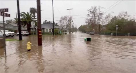 California storm: Kayakers paddle along flooded streets of Santa Barbara