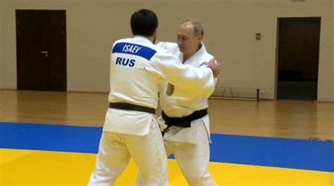 Black belt Vladimir Putin shows off his judo chops as he works out with ...