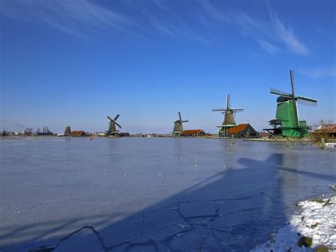 Windmills during winter in Zaandam the Netherlands - Photorator