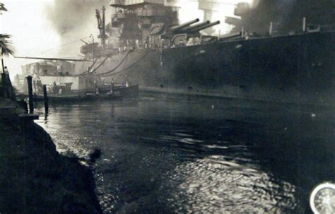 USS Tennessee (BB 43), burning and damaged after the Japanese attack on Pearl Harbor, 7 December ...