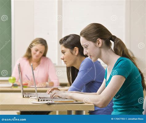 Students Using Laptops in Classroom Stock Image - Image of teenager, three: 17047703