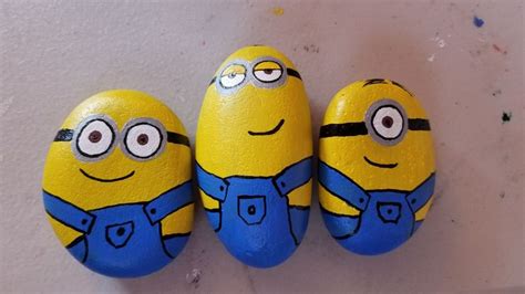 The minions | Diy rock art, Stone painting, Painted rock animals