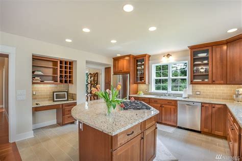 Cherry cabinets with light bright tile and counters | Kitchen redesign, Cherry cabinets kitchen ...