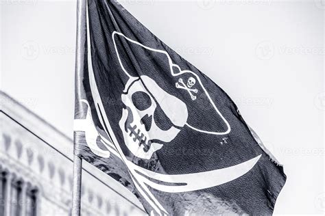 Old pirate ship flag 19796256 Stock Photo at Vecteezy