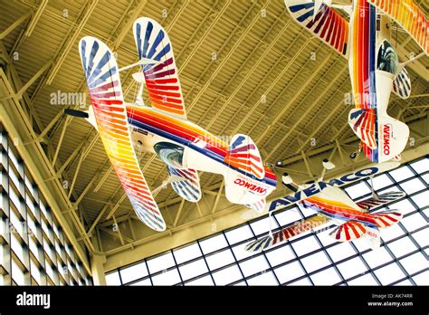 Pitts Special aerobatics planes hang from the ceiling at the EAA museum ...