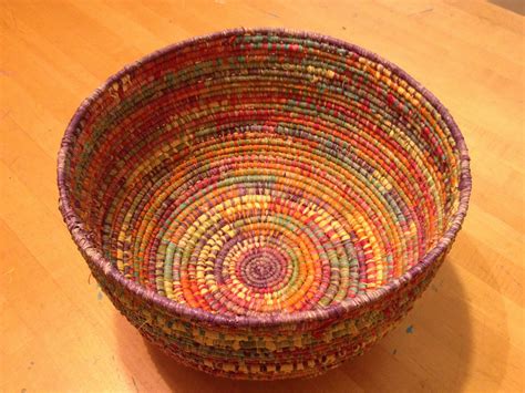 a colorful basket sitting on top of a wooden table