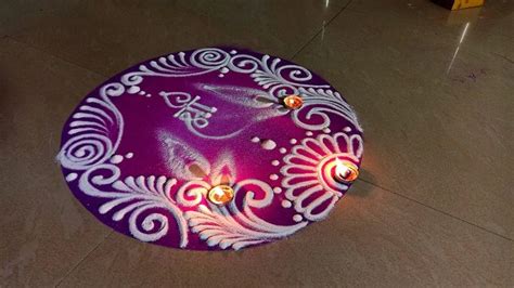 a purple and white decorative item with candles in it on the floor next ...