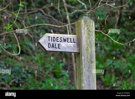 A wooden sign post saying Tideswell Dale, Derbyshire, England, UK Stock Photo - Alamy