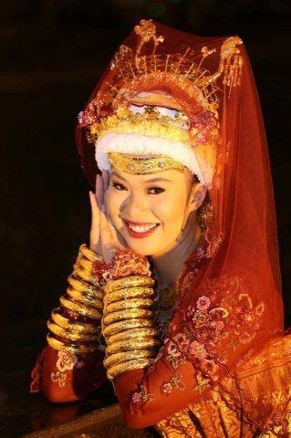 Brunei Lady in Traditional Costume by Charoonsak Sukawatano