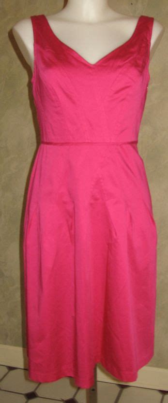 I recently got this dress. It also has a pink belt. It is maybe one size too big. Debating ...