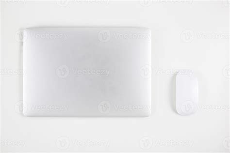 Top view of laptop computer with closed and mouse isolated on white ...